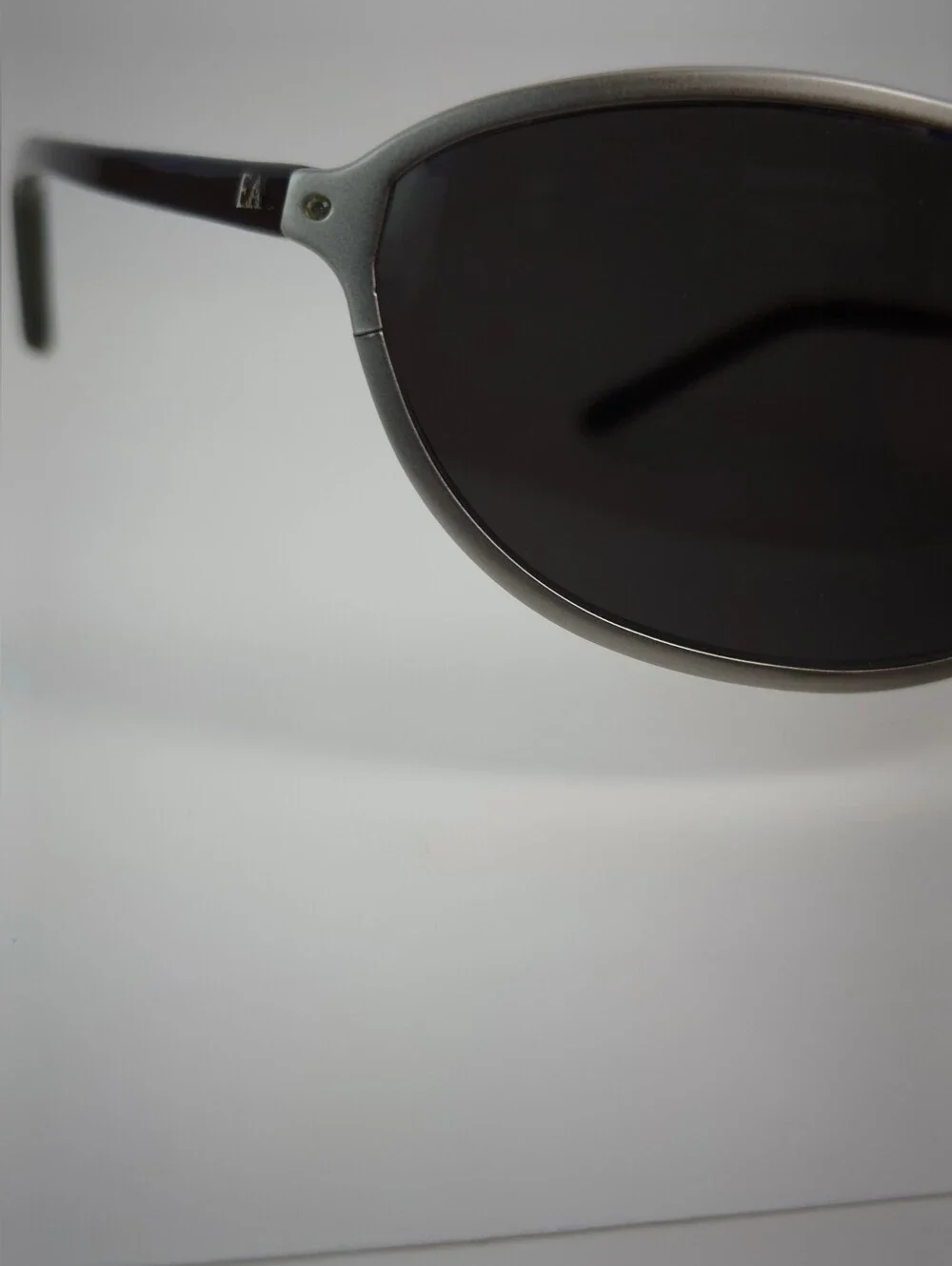 Elizabeth Arden Oval Wrap Sunglasses with Dark Lenses and Silver Frame